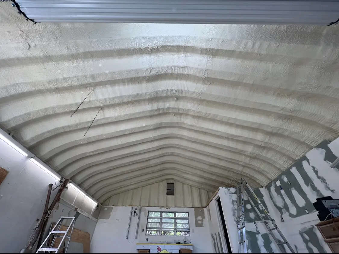 Spray polyurethane foam applied to the underside of a metal roof deck in Druid Hills